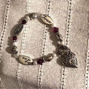 Silver tone bracelet for “Mother”.